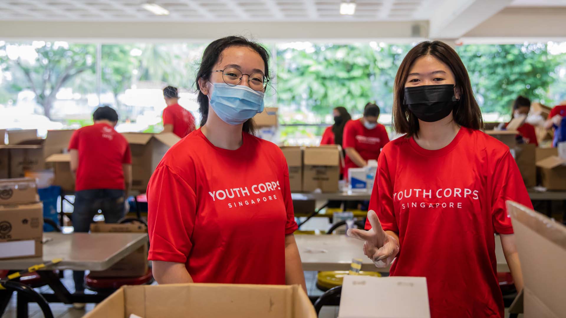 volunteers at care pack packing for our migrant brothers