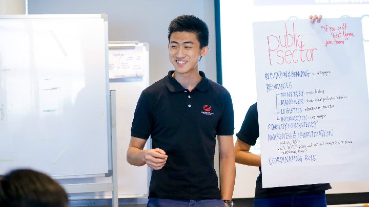 Youth wearing Youth Corps Singapore Polo Shirt