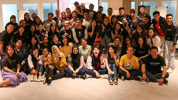 group of smiling cluster volunteers at the rallying force retreat 2019