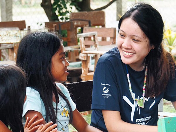 youth interacting with child